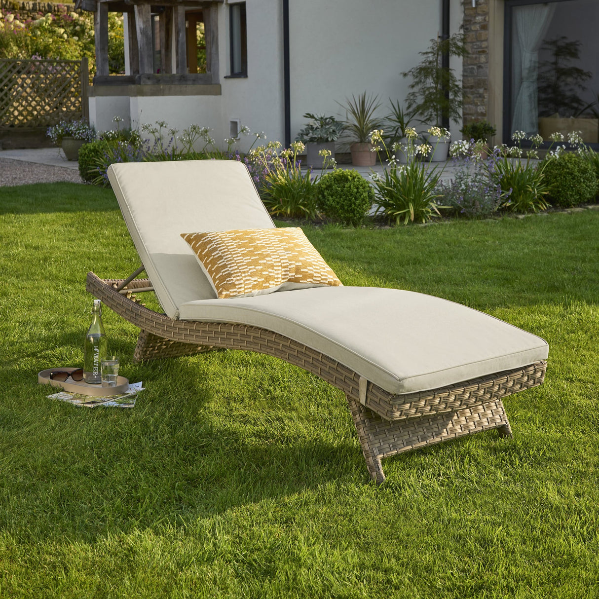 Kettler Charlbury Signature universal sun lounger with cushions, woven outdoor furniture for relaxing in the garden.