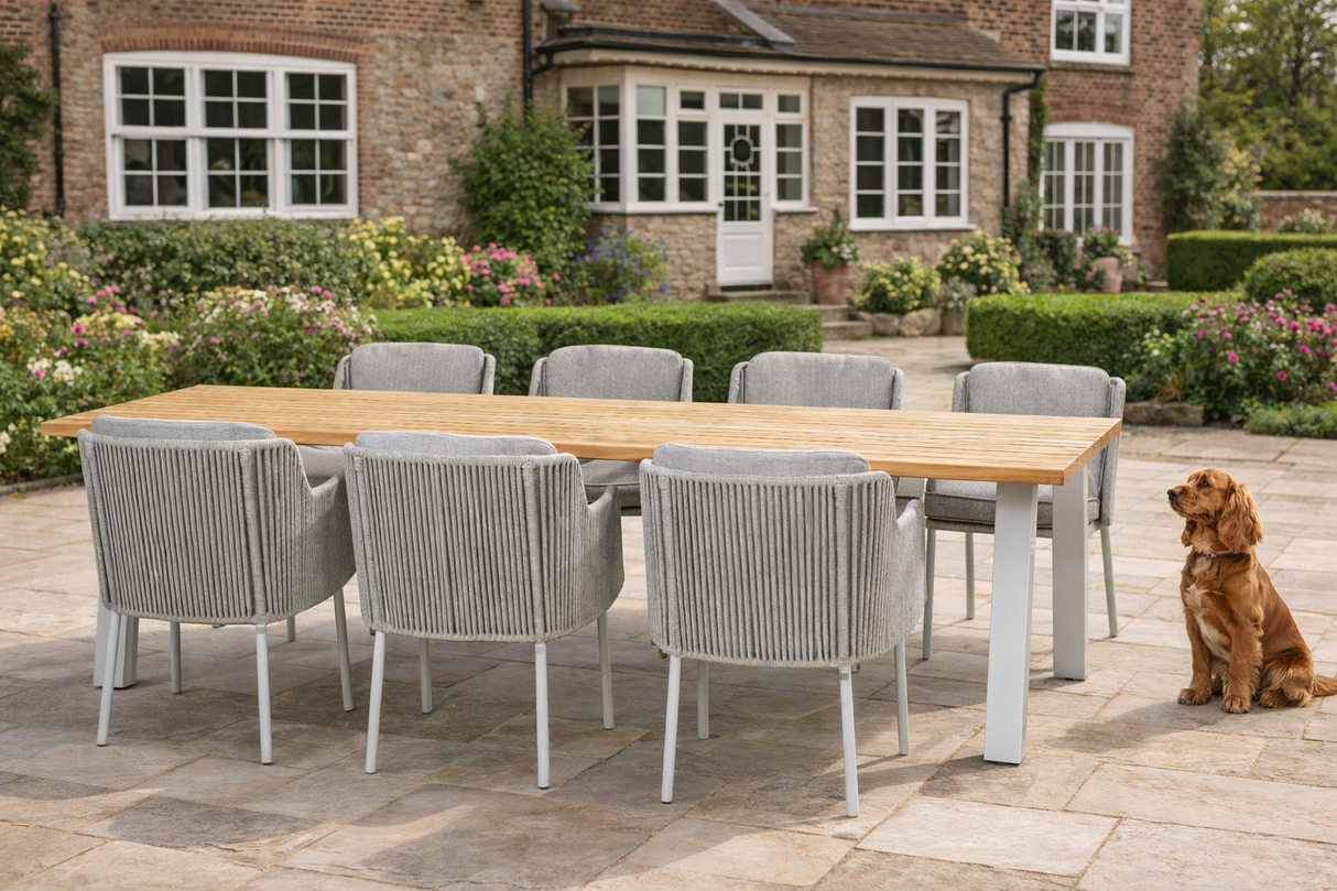 4 Seasons Outdoor Bernini six-seater rectangular dining set with metal frame and 240cm Ambassador teak dining table.