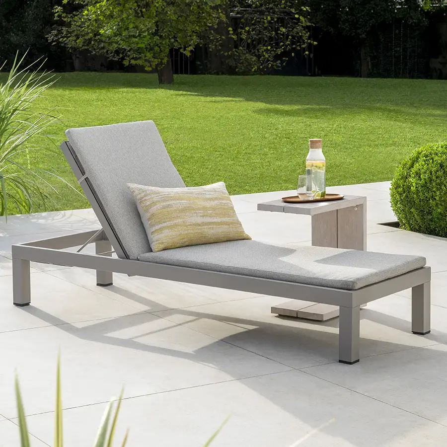 Kettler Pebble Drift side table with a metal frame, featuring a textured pebble finish for modern living room or patio decor.