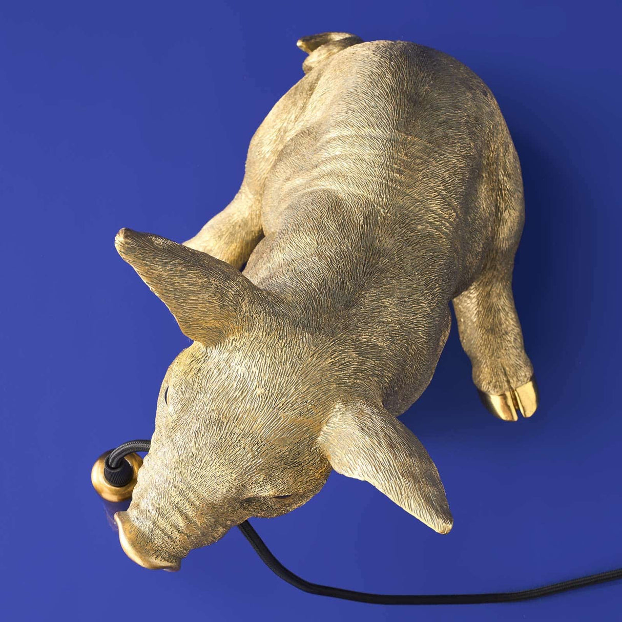 Gold WERNS® Piggy Pig table lamp by Werner Vob, a luxury designer pig-shaped indoor lighting fixture.