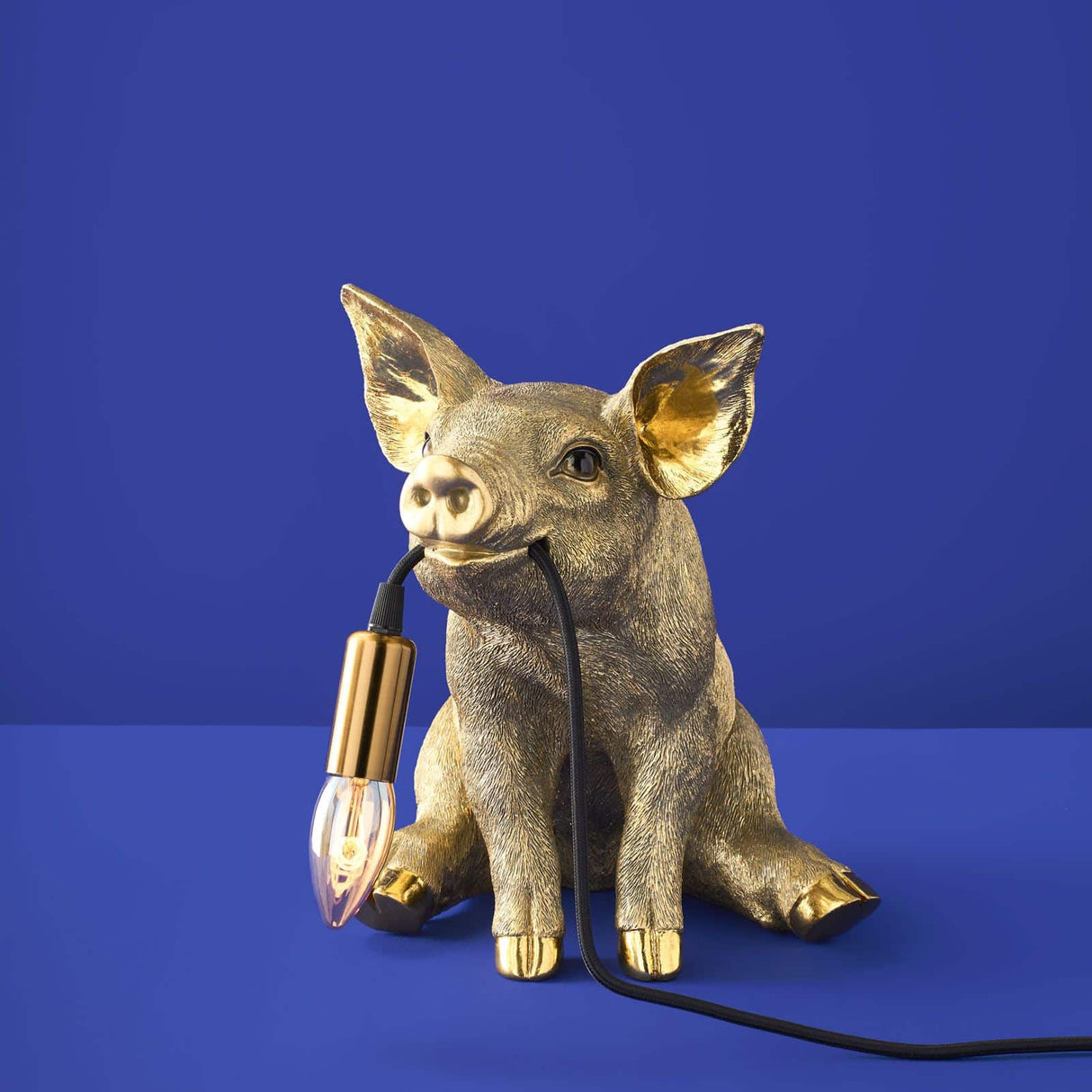 Gold Werner Vob WERNS® Piggy Pig table lamp with a playful pig design, perfect for luxury indoor home lighting.