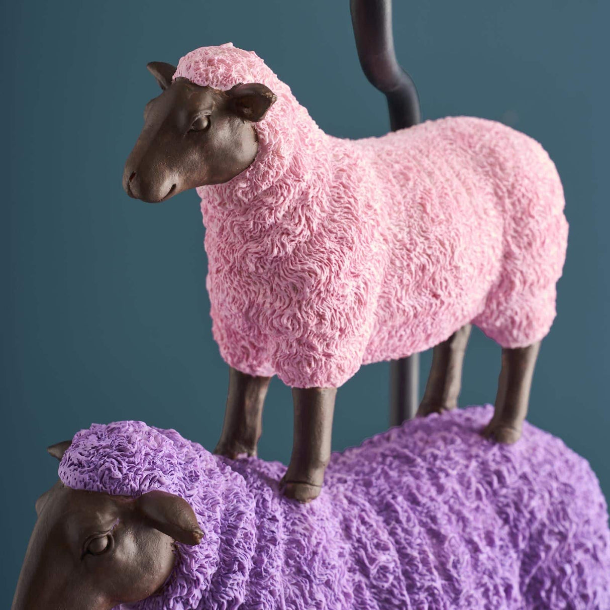 Colorful pink WERNS® sheep table lamp by Werner Vob, a luxury designer indoor lighting piece with playful sheep design.