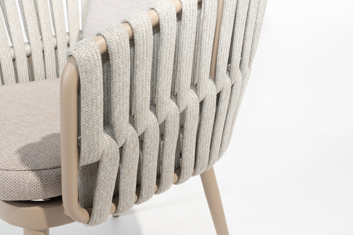 4 Seasons Outdoor Eva 6-seat metal dining set with Manolo 180cm barrel ceramic table and latte-colored dining chairs with cushions.