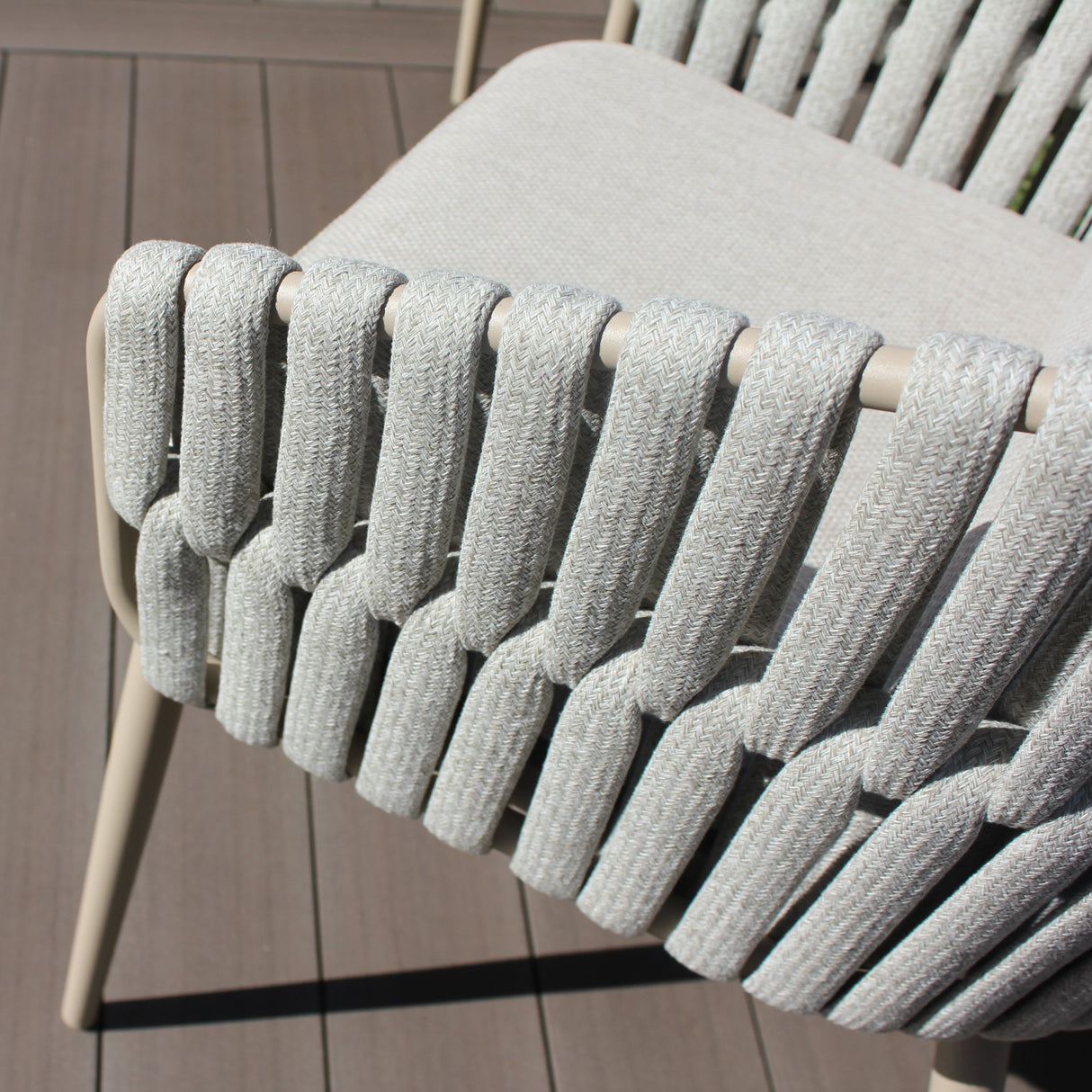 4 Seasons Outdoor Eva 6-seat dining set with latte-colored metal chairs, cushions, and a 180cm Manolo ceramic dining table.