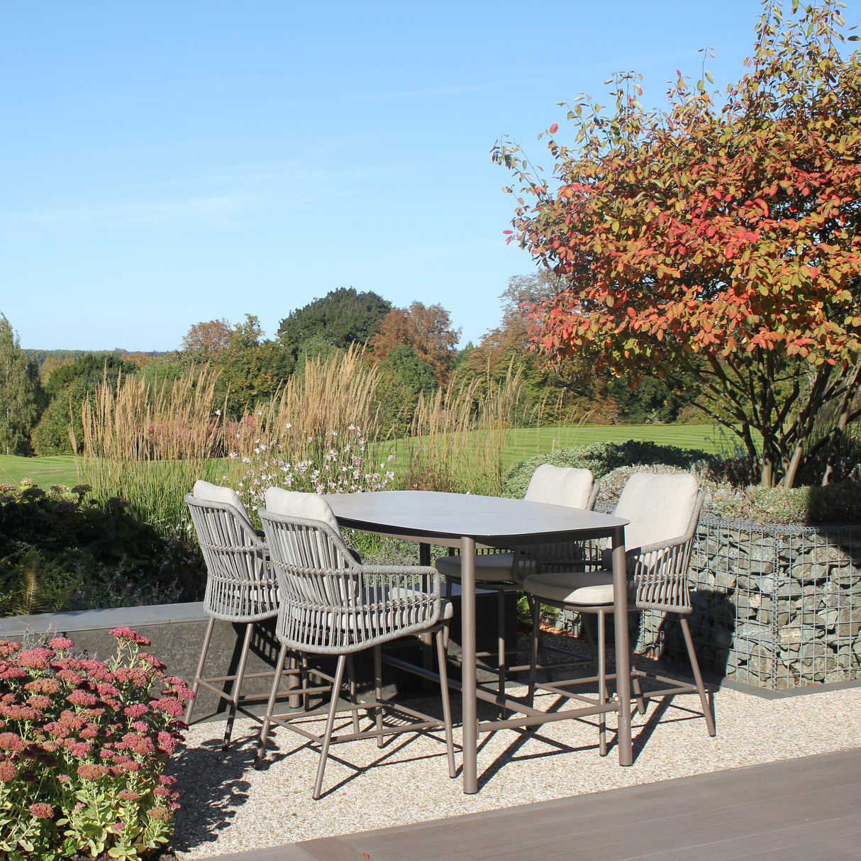 4 Seasons Outdoor Alicante 4-seat metal dining set with Manolo 180cm high ceramic table, featuring sleek design and sturdy construction.