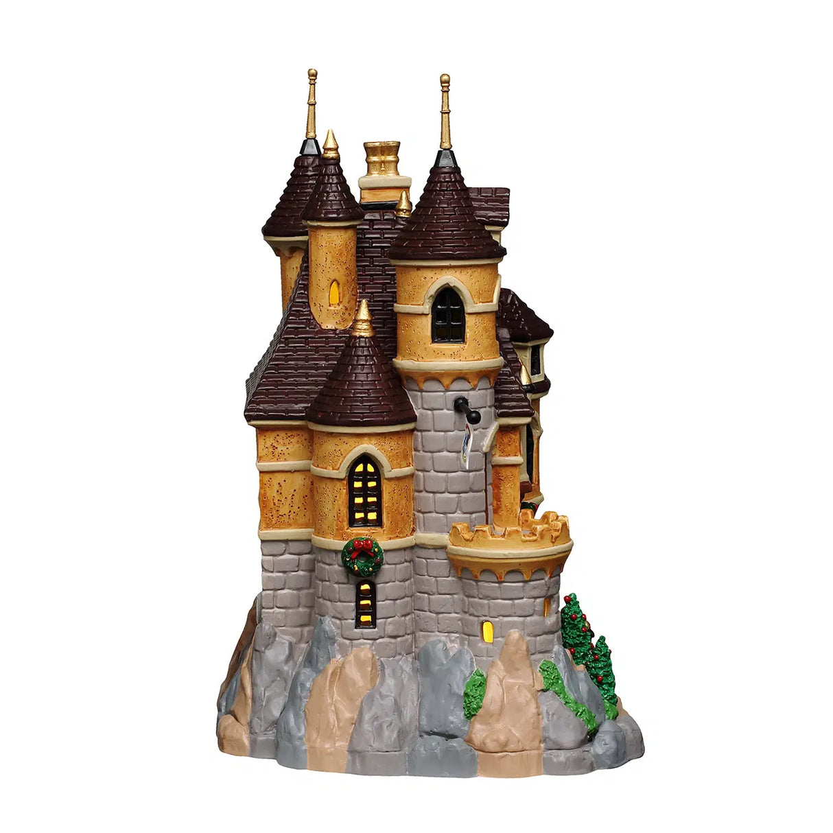 Illuminated Lemax Arie's Castle Christmas Village building with detailed castle design and festive lighting display.