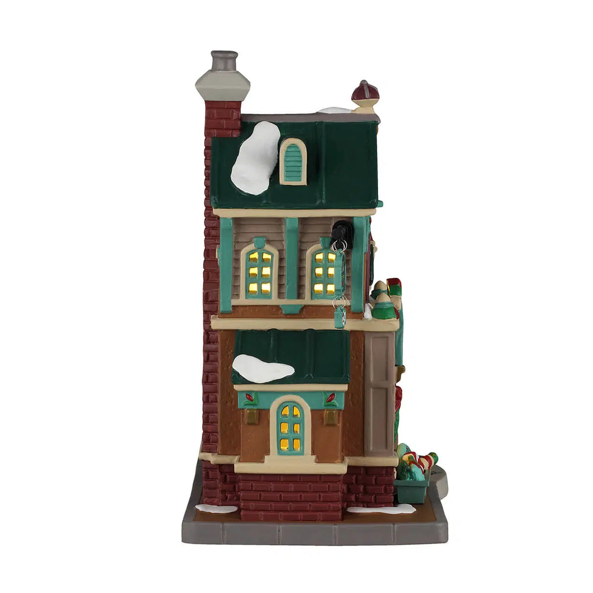 Lemax illuminated building Cathy’s Cushion Corner from the Christmas Village series, featuring a cozy corner shop with festive lights.