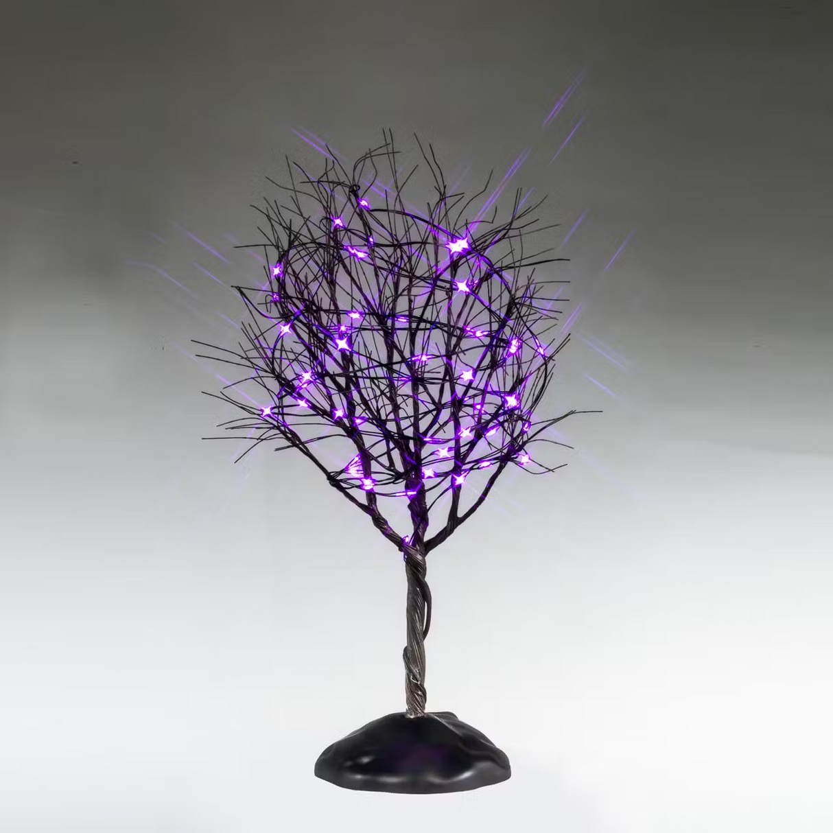 Lemax Spooky Town dry tree decorated with purple lights, part of the Lemax Trees collection, suitable for Halloween displays.