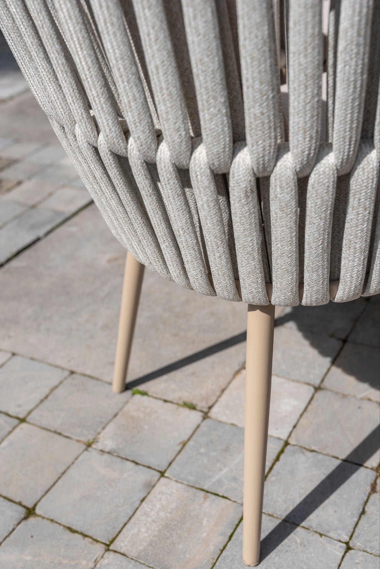 4 Seasons Outdoor Eva 6-seat metal dining set with Manolo 180cm ceramic barrel table and matching dining chairs.