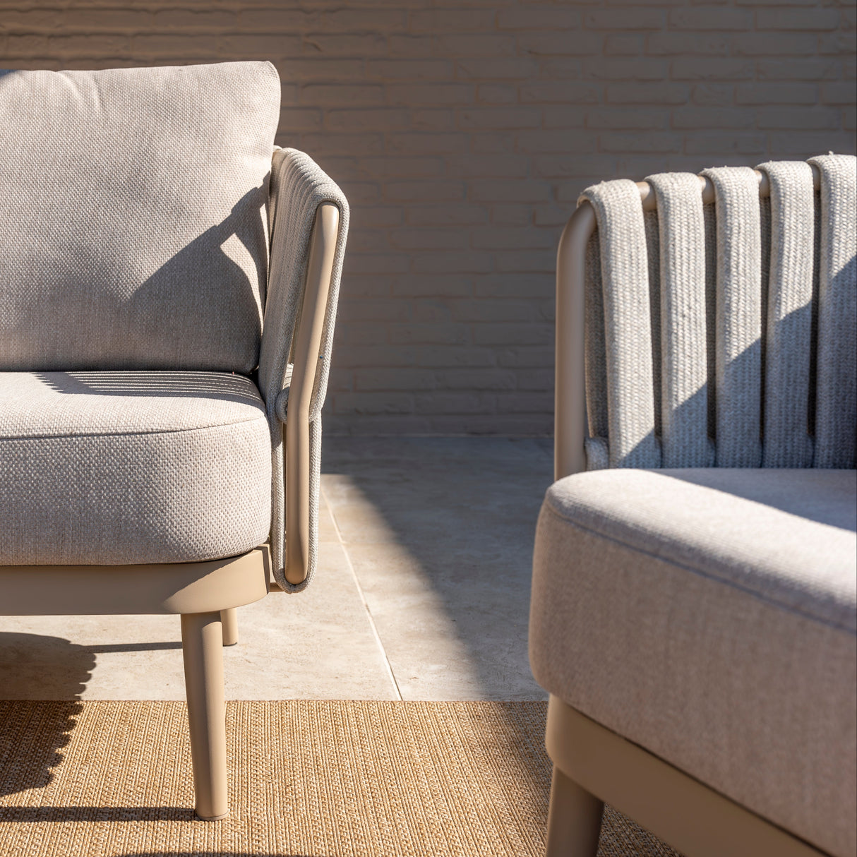4 Seasons Outdoor Eva lounge set with two Monroe coffee tables and a support table, featuring metal frames and cushioned seating.
