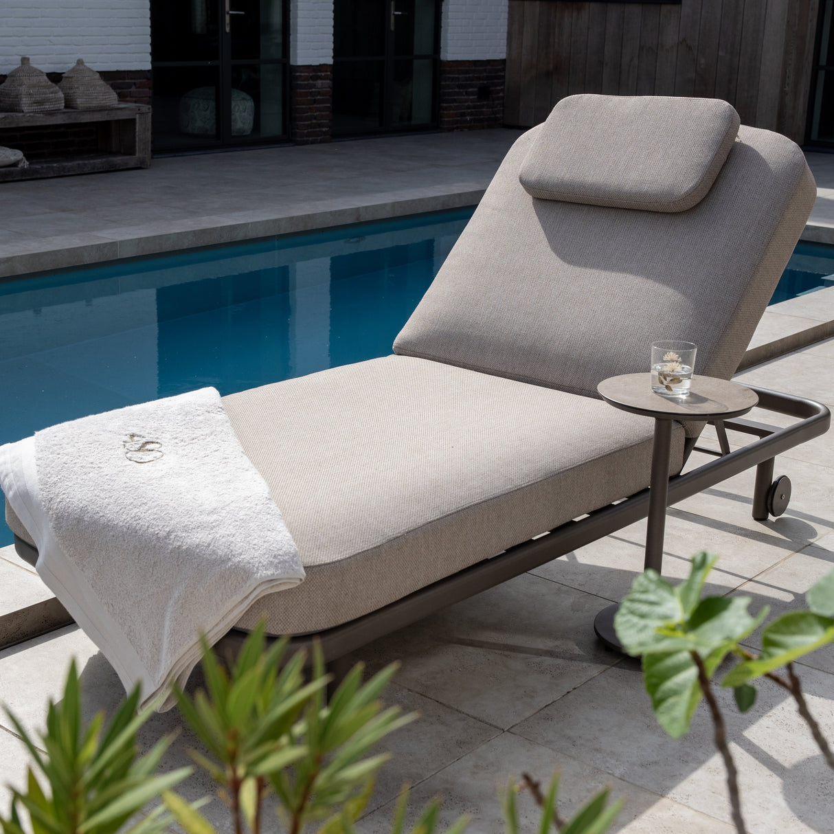 4 Seasons Outdoor Milano Terre sunbed in latte with cushion and headrest, metal outdoor furniture for relaxing outdoor spaces
