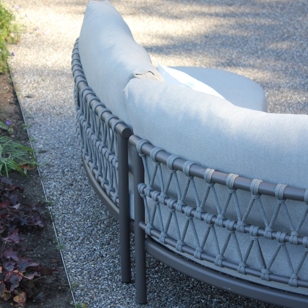 Close-up of the 4 Seasons Outdoor Piacenza modular lounge with Terre Monroe coffee tables, showcasing metal furniture details.