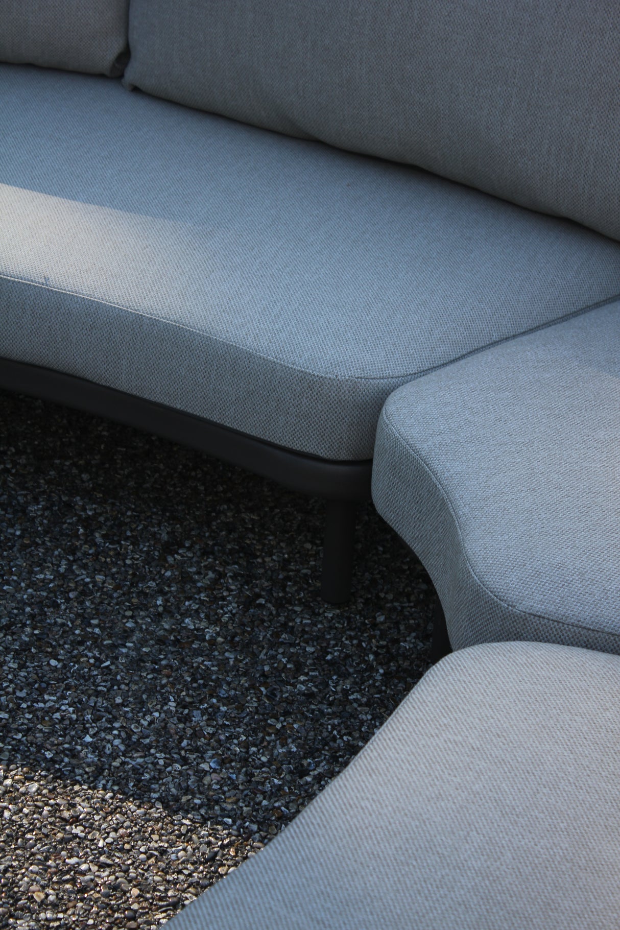 Close-up of the 4 Seasons Outdoor Piacenza modular lounge with Terre Monroe coffee tables, showcasing metal furniture design.