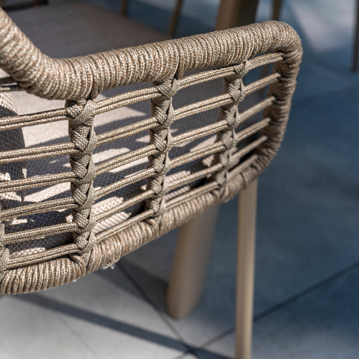 4 Seasons Outdoor Puglia 6-seat round dining set with Donato Latte metal table and matching chairs for outdoor dining.