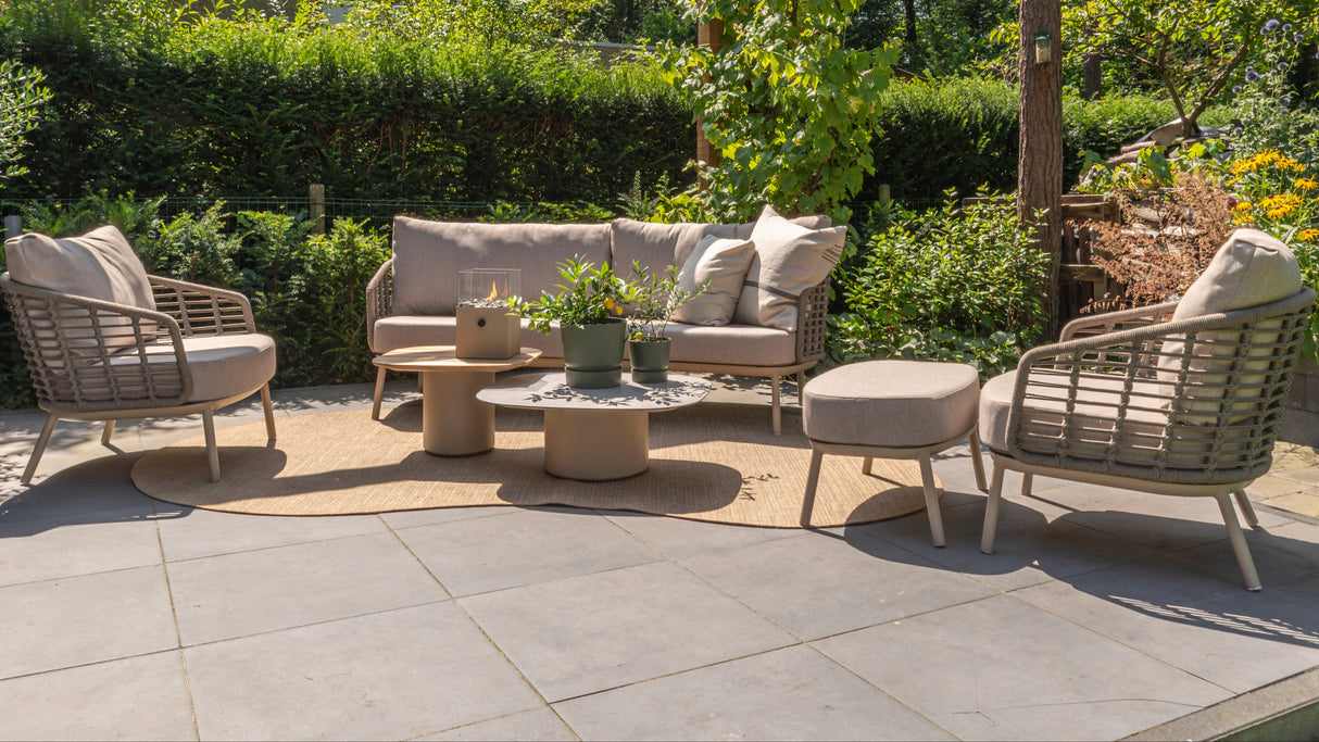 4 Seasons Outdoor Puglia lounge set in latte with 3-seater sofa, chairs, footstool, and tables for outdoor use.