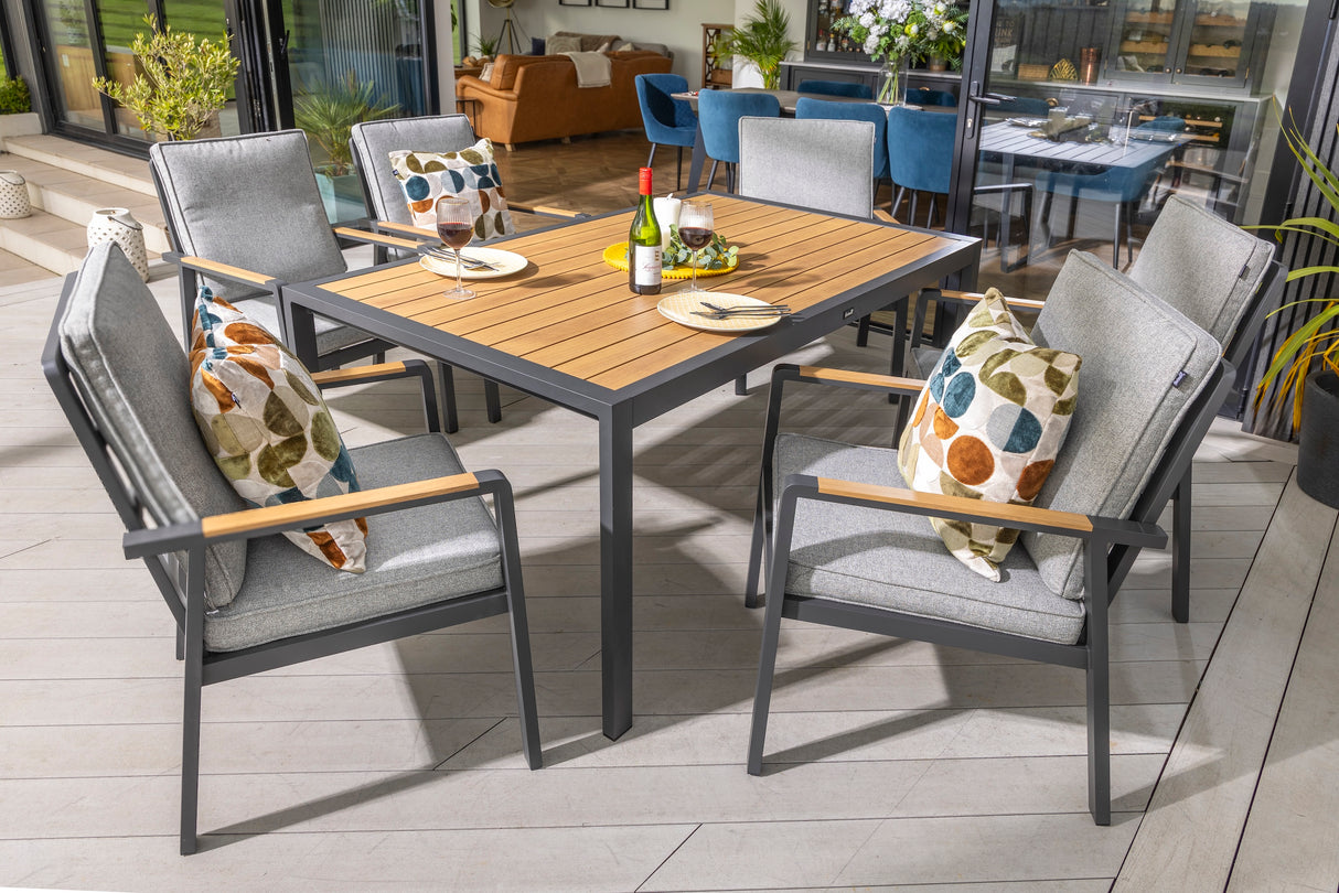 Hartman Sonas 6-seat rectangular aluminum garden dining set with sleek table and matching chairs in a modern outdoor setting.