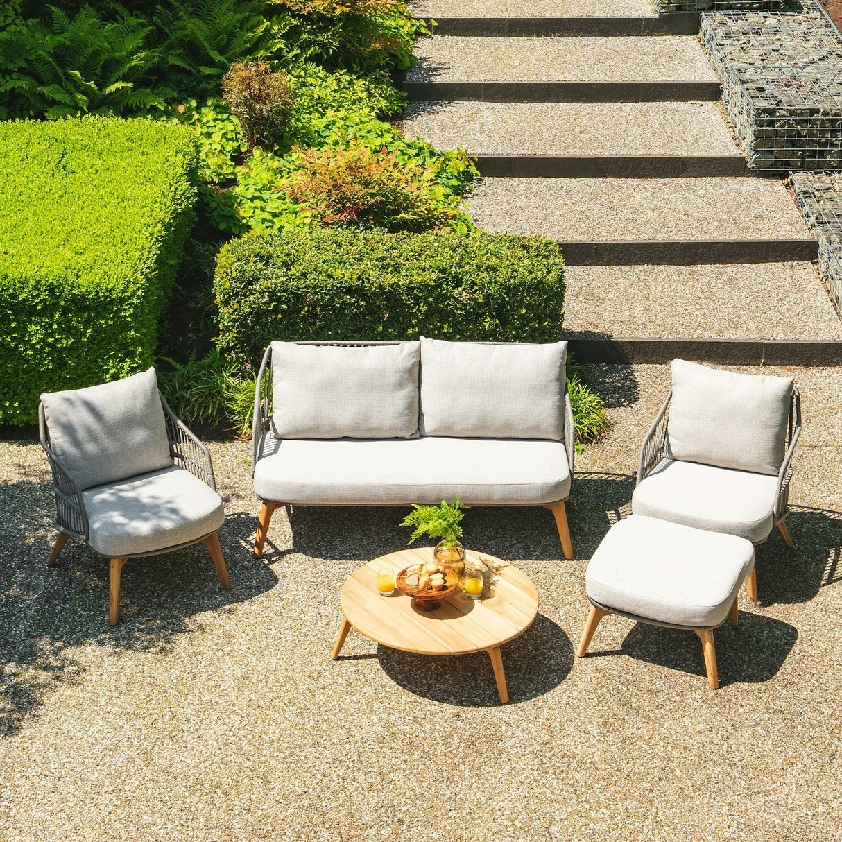 4 Seasons Outdoor Ancora Lounge Set – 2 Armchairs, 2.5-Seater Sofa, Footstool & 90cm Round Teak Coffee Table - Mill Race Garden Centre