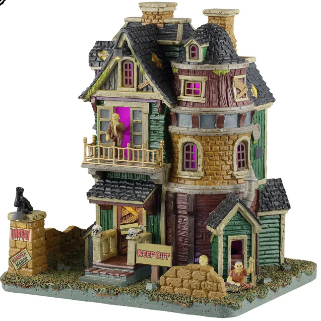 Lemax Spooky Town Undead Manor decoration featuring a spooky haunted house with eerie undead figures.