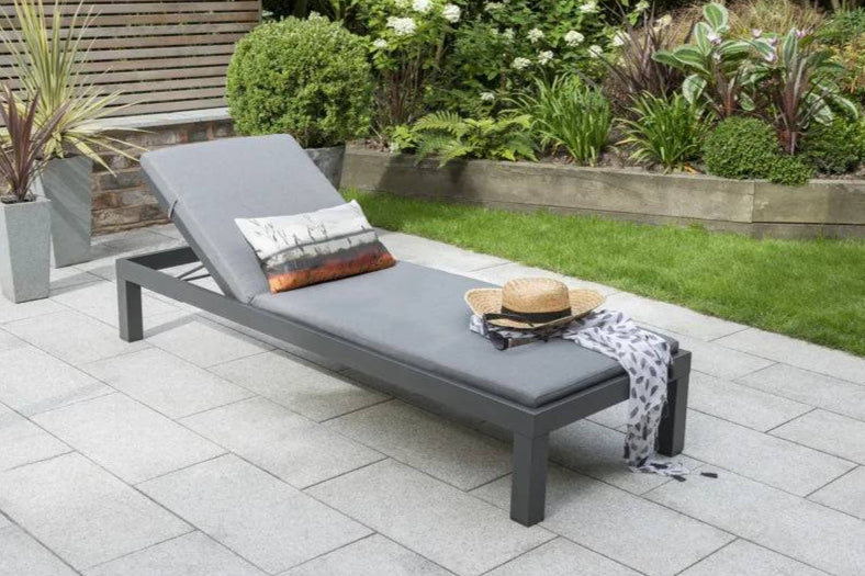 Kettler Elba Signature grey sun lounger with cushion, metal outdoor furniture for relaxing in the garden or patio area.