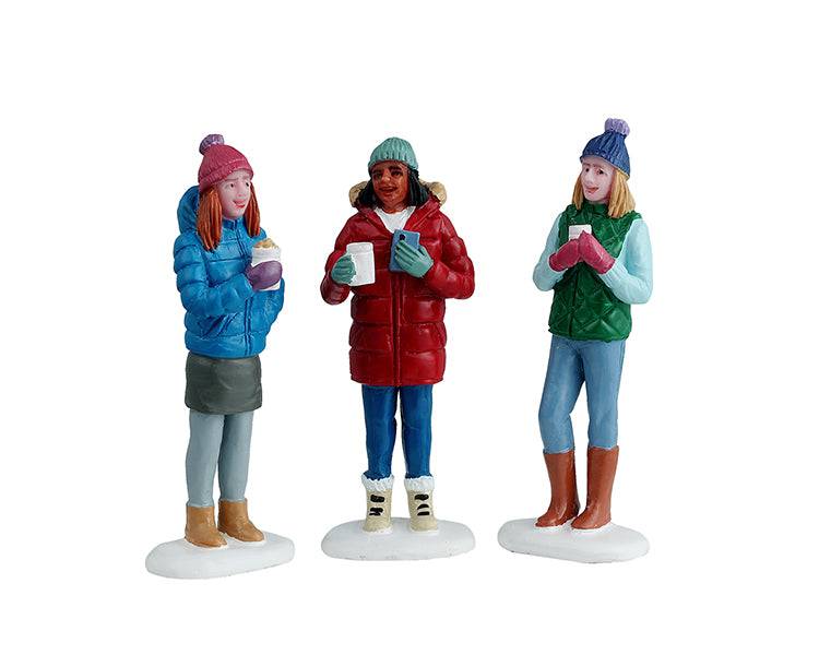 Set of 3 Lemax Christmas Village figurines featuring friends enjoying hot cocoa, part of the Lemax Christmas Village collection.
