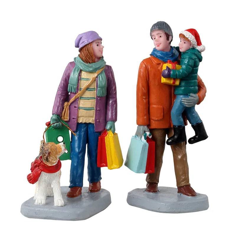 Set of 2 Lemax Christmas Village Holiday Shoppers figurines, detailed festive holiday characters for holiday decor.