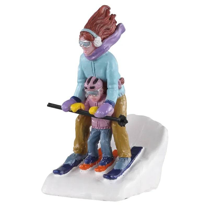 Lemax Mommy and Me Ski Christmas Village figurine, depicting a mother and child enjoying winter skiing in a festive scene.