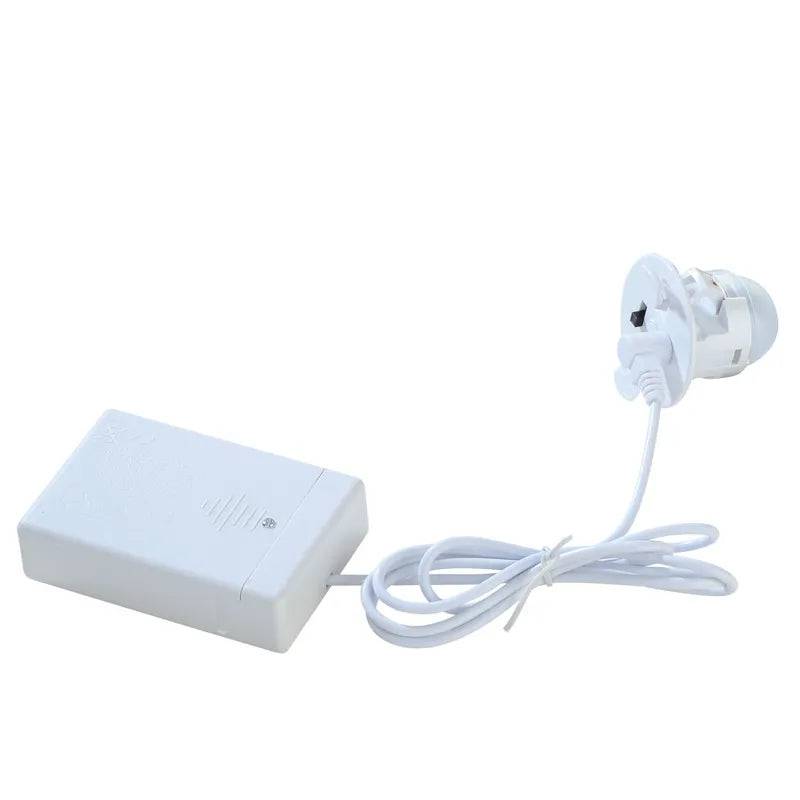 Lemax Christmas Village LED light string called Moonlander with adapter, used for holiday village lighting display.