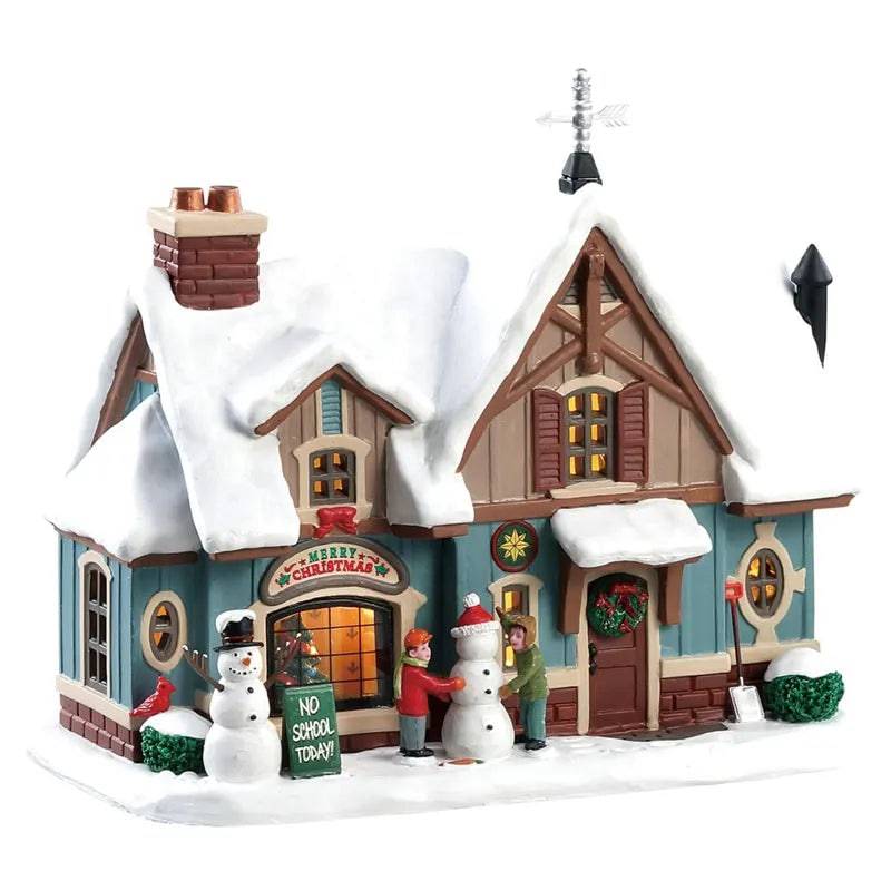 Lemax Snow Day Christmas Village illuminated building with festive winter scene and detailed holiday decorations.