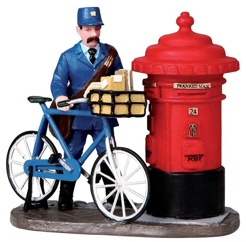 Lemax Christmas Village figurine depicting a postman delivering mail in a festive village scene.