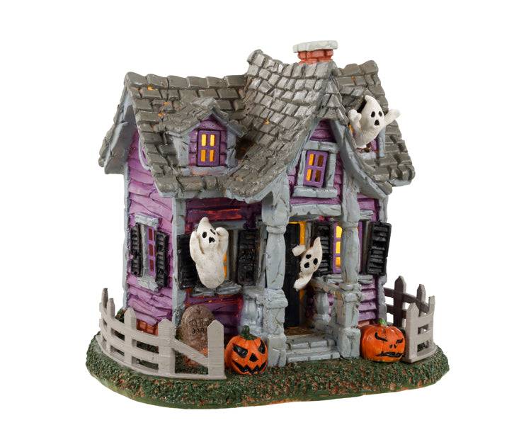 Lemax Spooky Town Ghost Cottage table accent with haunted house details and eerie lighting for Halloween display.