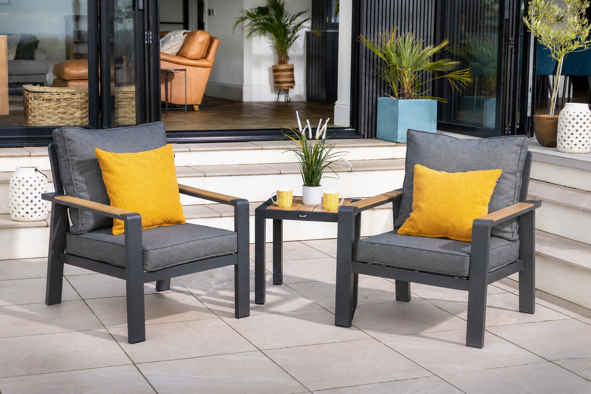 Two Hartman Sonas Bistro chairs with a side table, made of metal, perfect for outdoor garden seating.