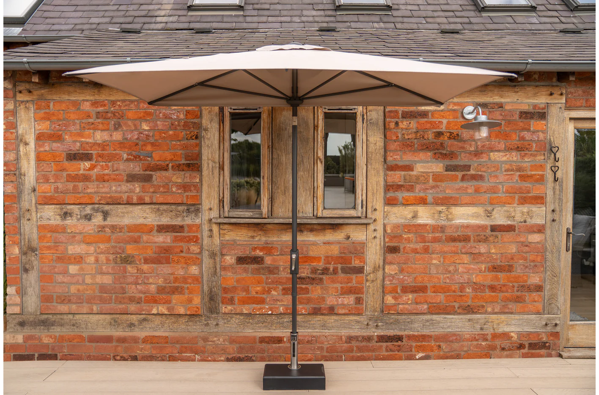 Wall-mounted Kettler rectangular balcony parasol with auto tilt and night cover, featuring wind-up mechanism for adjustable shading.