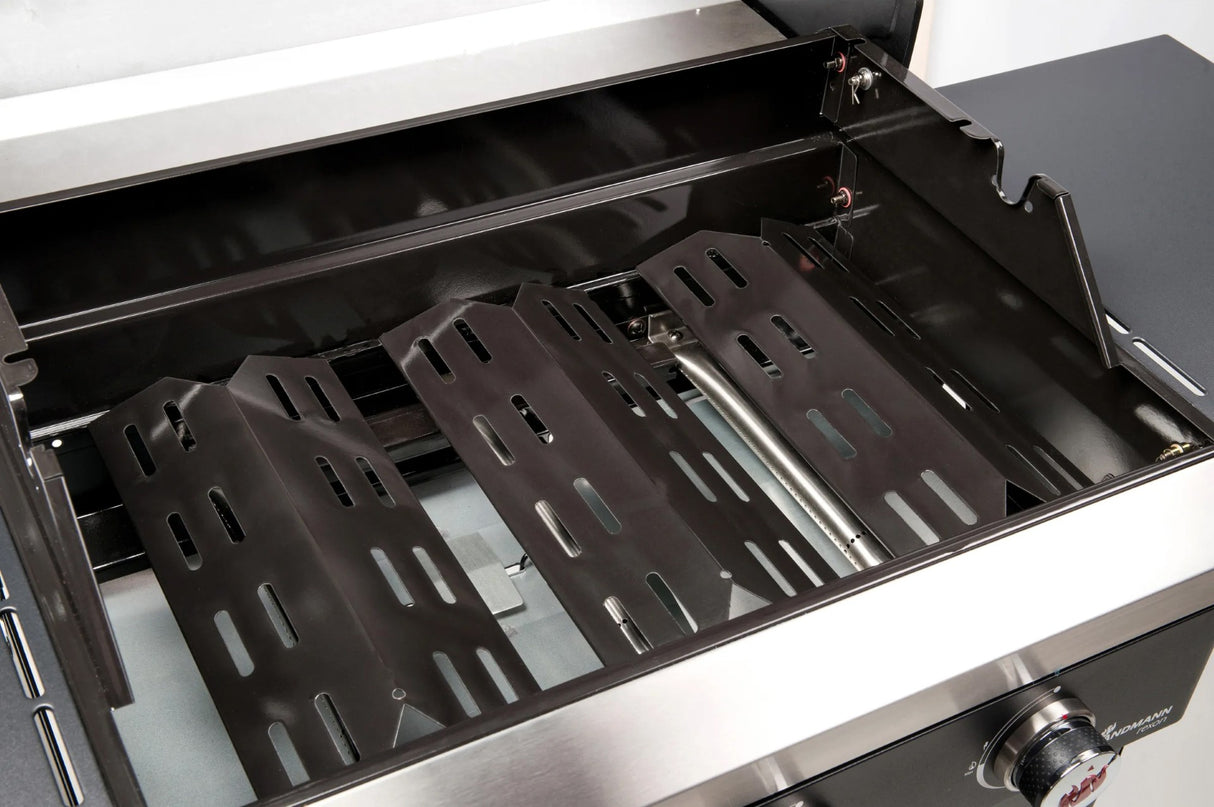 Atom Grills Xenon 3.1 Gas BBQ with stainless steel surface and four burners, perfect for outdoor grilling and cooking.