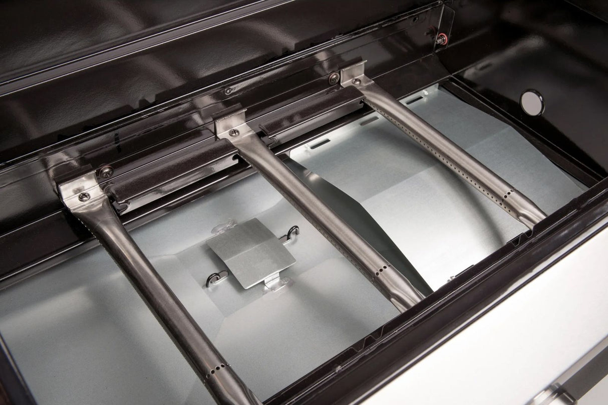 Atom Grills Xenon 3.1 gas BBQ with stainless steel lid, side shelves, and multiple burners for outdoor grilling.