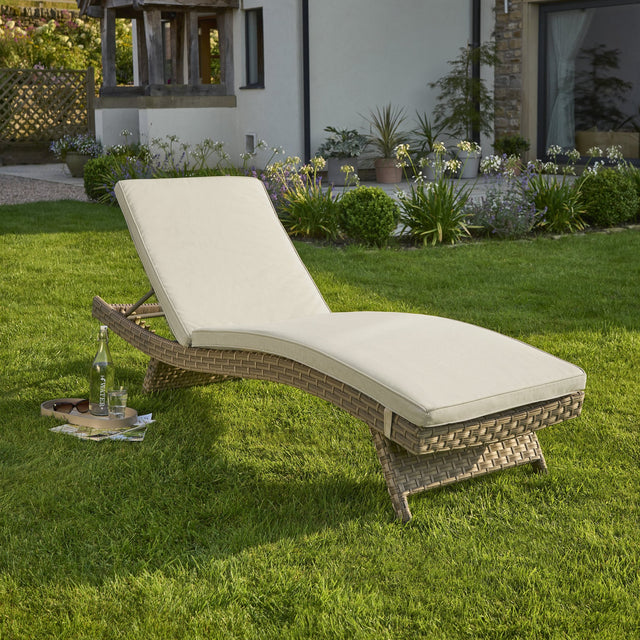 Kettler Charlbury Signature universal sun lounger with cushions, outdoor furniture in a relaxed lounge position on a patio.