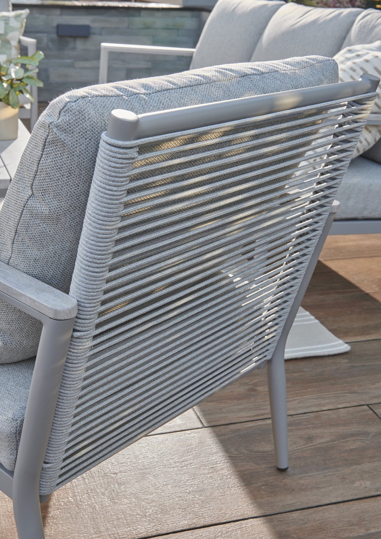 Kettler Trento 5-seat rope lounge set with metal frame, outdoor cushions, and stylish lounge chairs in a backyard setting.