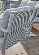 Kettler Trento 5-seat rope lounge set with metal frame, outdoor cushions, and stylish lounge chairs in a backyard setting.