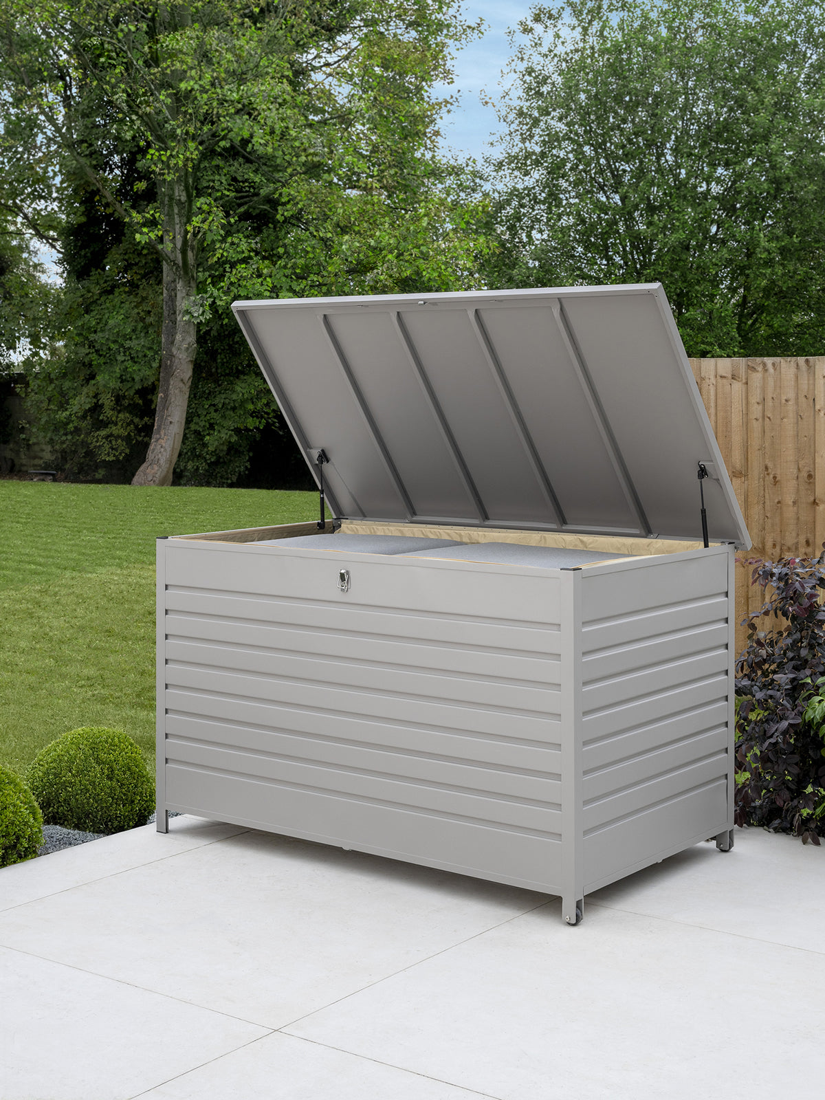 Open Kettler Pebble aluminium storage cushion box showing spacious interior for outdoor cushions or garden tools.