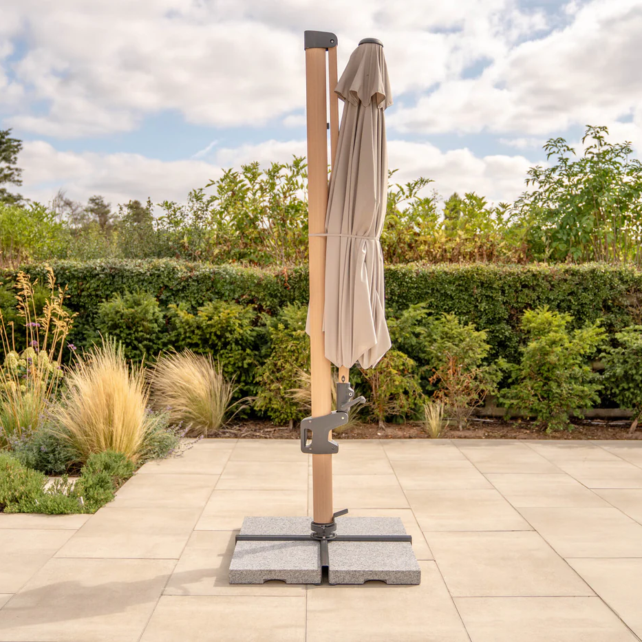 Kettler Luna 3m round cantilever parasol with taupe/grey canopy, granite base, and night cover for outdoor furniture shade