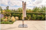 Kettler Luna 3m round cantilever parasol with slate canopy, granite base, and night cover for outdoor furniture.