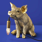 Gold Werner Vob WERNS® Piggy Pig table lamp with a stylish pig design, perfect for luxury indoor statement lighting.