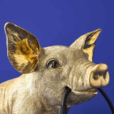 Gold WERNS® Piggy Pig table lamp by Werner Vob, featuring a luxurious designer pig shape for stylish indoor lighting.