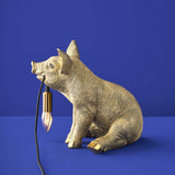 Gold WERNS® Piggy Pig table lamp by Werner Vob, luxury designer pig-shaped indoor lighting for stylish home decor.