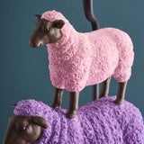 Colorful pink WERNS® sheep table lamp by Werner Vob, a luxury designer indoor lighting piece with playful sheep design.