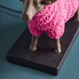 Colorful pink sheep table lamp by Werner Vob, luxury designer indoor lighting featuring playful, statement-shaped sheep decor.