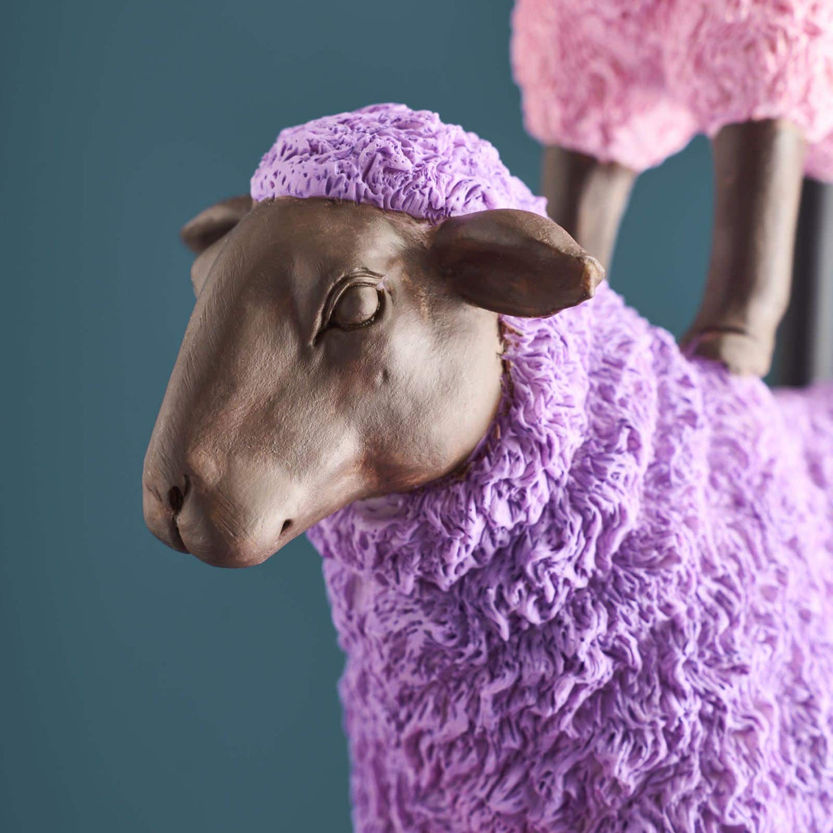 Colorful pink sheep-shaped table lamp by Werner Vob, a luxury designer statement lighting piece for indoor home decor.