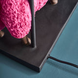 Colorful pink WERNS® sheep table lamp by Werner Vob, a luxury designer statement lighting piece for indoor home decor.
