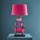 Colorful pink WERNS® sheep table lamp by Werner Vob, luxury designer indoor lighting with playful sheep shape, decorative statement piece.