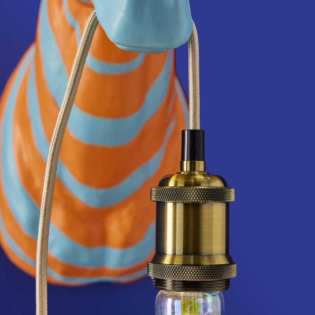 Blue and orange WERNS® Zebra Zora wall lamp by Werner Vob, featuring a luxury designer zebra-shaped indoor lighting fixture.