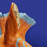 Blue and orange zebra-shaped wall lamp by Werner Vob, modern designer lighting for indoor home decor.